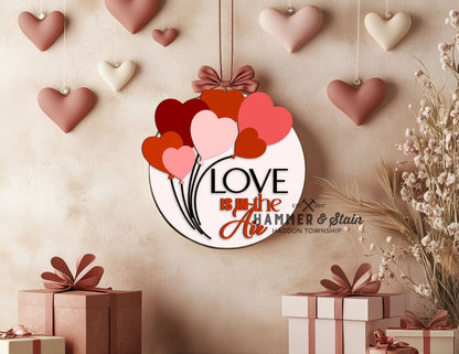 Heart balloons with the words Love is in the Air DIY doorhanger at Hamemr and Stain HAddon in Haddon Township, NJ